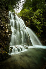 Cascada Urlatoarea Busteni (Urlatoarea waterfall) Howling in Bucegi mountains, Romania near to Sinaia. Nature wonder in the Carpathian Mountains park.