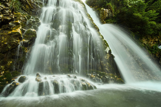 Cascada Urlatoarea Busteni (Urlatoarea waterfall) Howling in Bucegi mountains, Romania near to Sinaia. Nature wonder in the Carpathian Mountains park.