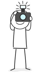 Fotograf hält Kamera in der Hand und macht ein Foto