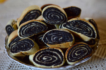 baked poppy seed strudels in ceramic bowl at the table