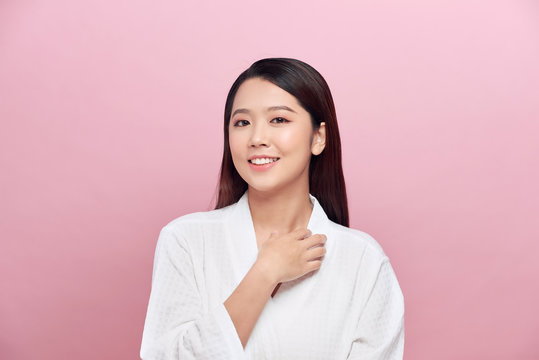 attractive asian woman skin care image on pink background