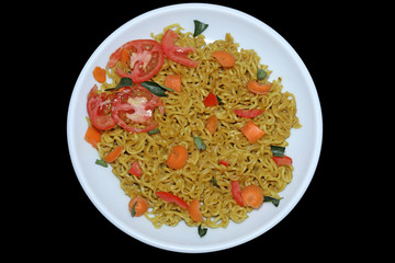 vegetables noodles in white plate at dark background. Schezwan Noodles is indo-chinese cuisine hot dishes with udon noodles,