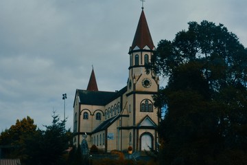 well-kep colonial church of Puerto Varas, under a cloudy sky in cold winter