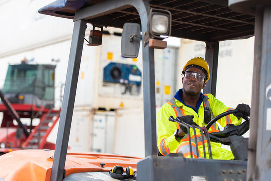 Industrial warehouse factory worker operating on floklift in the container yard.