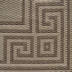 Texture of a woven fabric with elements of an ornament located in a corner