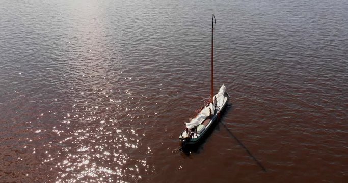 Giant frisian dutch sailboat (skutjse) on huge lake tjeukemeer AERIAL FULL HD