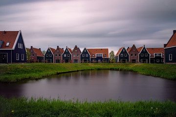 typical colorful Dutch houses by the lake
