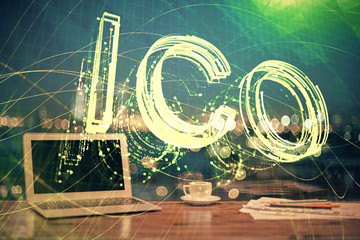 Multi exposure of blockchain theme hologram and table with computer background. Concept of bitcoin...