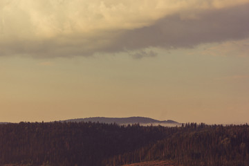 Russia. Travel across Russia. Hills, mountains and fields. Panorama at sunset.