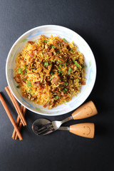 Mutton Biryani or Lamb Pulao. Garnished with fried onion & chopped coriander. Biryani is a famous Spicy non vegetarian dish of India. Goat meat cooked along with Basmati rice & spices. 
