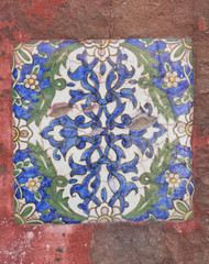 Detail of a Victorian Ceramic Tile within a ruin