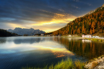 Fototapeta premium Dolomites mountains reflected in the Lago mi Misurina Lake at sunset, South Tyrol. Italy