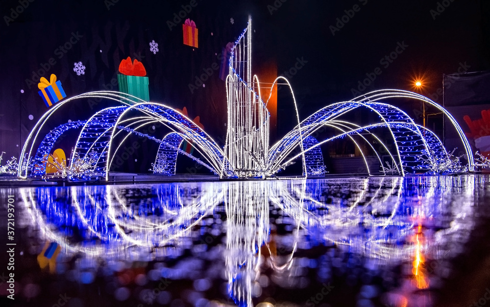 Wall mural Fountain decorated with lights of different color