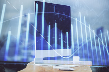 Forex market chart hologram and personal computer background. Double exposure. Concept of investment.