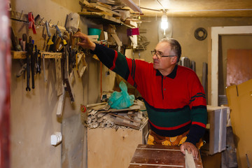 Image of mature carpenter in the workshop