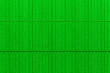 Modern green stone wall with stripes texture and seamless background