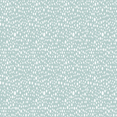 Seamless vector background with random white ovals. Abstract ornament. Dotted abstract pattern