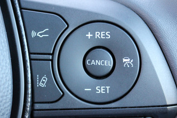 Cruise control buttons on a steering wheel