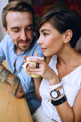 Pensive woman with cup of cappuccino