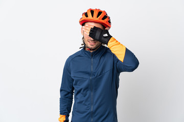 Young cyclist man isolated on white background covering eyes by hands. Do not want to see something