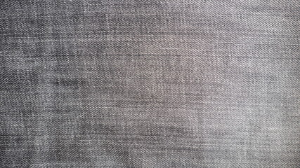 Closeup of black jeans texture and rough surface for background and decoration
