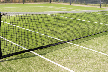 Fototapeta premium Tennis net and court. Playing Tennis. Healthy lifestyle