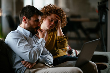 Businesswoman and businessman discussing work in office. Two friends in working together.