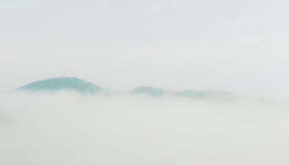 The beautiful landscape of heavy misty mountain.