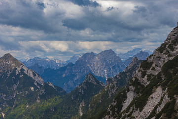 Panorama of the Cadore dolomites with cloudy sky and Monte Civetta recognizable in the background on the right. View from the East
