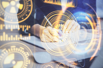 Fototapeta premium Tech theme hologram over woman's hands taking notes background. Concept of hightech. Double exposure