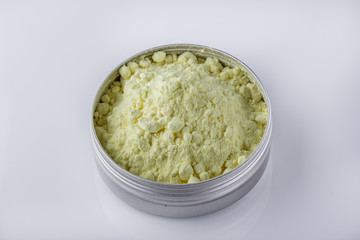 purified sulfur powder on a white acrylic background