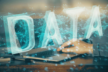 A man working on Laptop with technology theme drawing. Concept of big data. Double exposure.