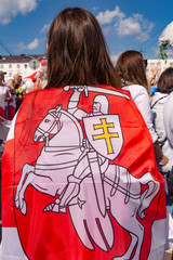 Vitebsk, Belarus - August 16, 2020 : a girl with national flag of the state of belarus , the rally in Belarus.