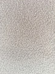 Fabric background detail close up particle surface cream color