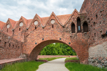 Fototapeta na wymiar The ruins of the teutonic order castle in Torun, Poland. Brick construction built in 13th century. Part of the medieval town of Thorn, one of the World Heritage of Poland next to Vistula river.