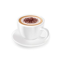 Cappuccino with froth, decorated with grated chocolate, in white cup and saucer.