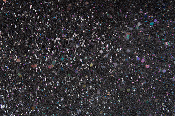 Black texture with multicolored shiny stones, rhinestones