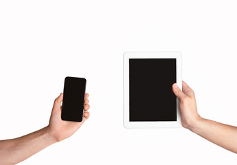 Modern cellphone and tablet computer in male hands, isolated on white. Collage with mockup for your design