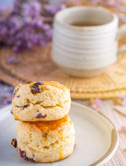 Traditional English scones with a tea cup and blurred background