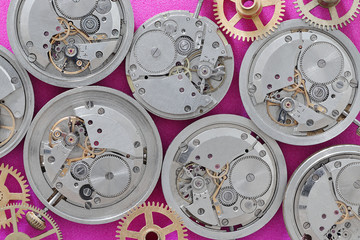 Old mechanical watch movements from a watch repair shop.