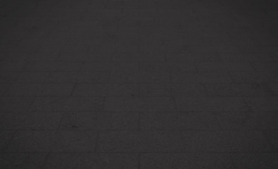 Black concrete paver block floor pattern for background.