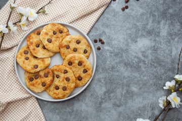 Chocolate chip cookies, top view. Dark background.