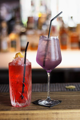
Beautiful cocktails on the bar in beautiful glasses. A restaurant. Bar menu. Alcoholic drinks. Nice presentation. Place for text