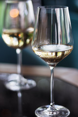 White wine in glasses. Close-up. A restaurant