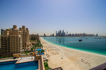Fototapeta premium DUBAI, UAE - MARCH31 : View of modern skyscrapers in Jumeirah beach residence on March 31, 2016 in Dubai, JBR - artificial canal city, carved along a 3 km stretch of Persian Gulf shoreline.