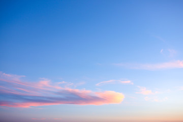 Naklejka na ściany i meble The sky at sunset. Blue and pink sky with clouds