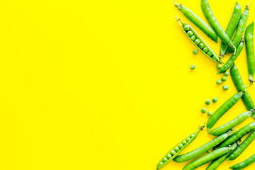 Set of green pea pods on bright background