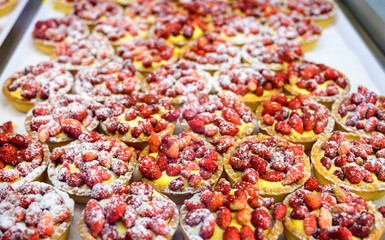 Wild strawberry and raspberry cakes in ancient city of strawberry Nemi, Castelli Romani, Italy