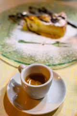 Classic italian espresso coffee served with homemade apple cheese cake with chocolate