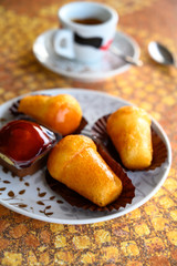 Classic italian espresso coffee served with homemade rum baba soft cake